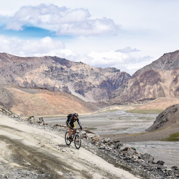 group-of-cyclists-riding-down-rocky-terrain-himalayan-highway-credit-matt-westby
